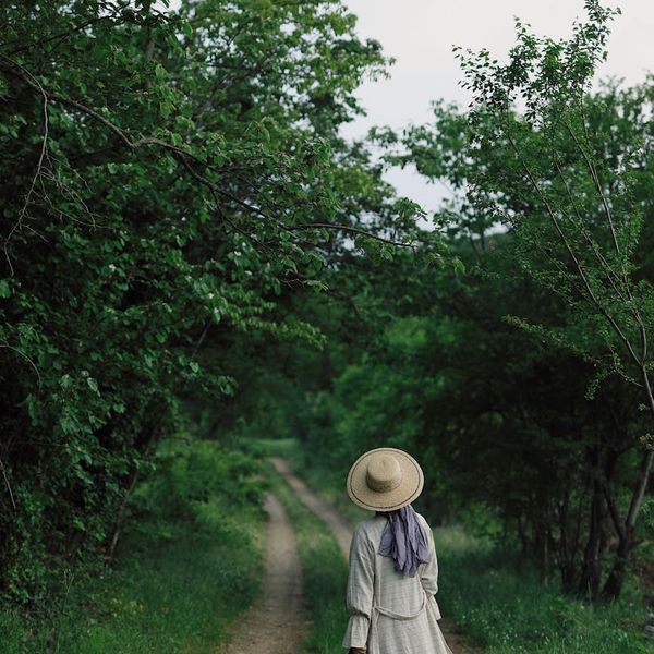 A serene landscape with a path leading towards a rising sun, symbolizing well-being.